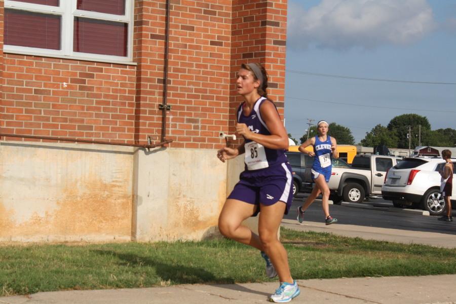 Kayla Bruemmer runs past a Clever runner at Strafford.