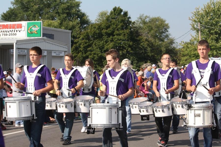 Left to right: Elijah Stafford (10), Austin Masters (12), Luke Cockroft (11), Craig Brinkman (9), and Brian Carroll (9) march at the Fall Festival earlier in the school year.