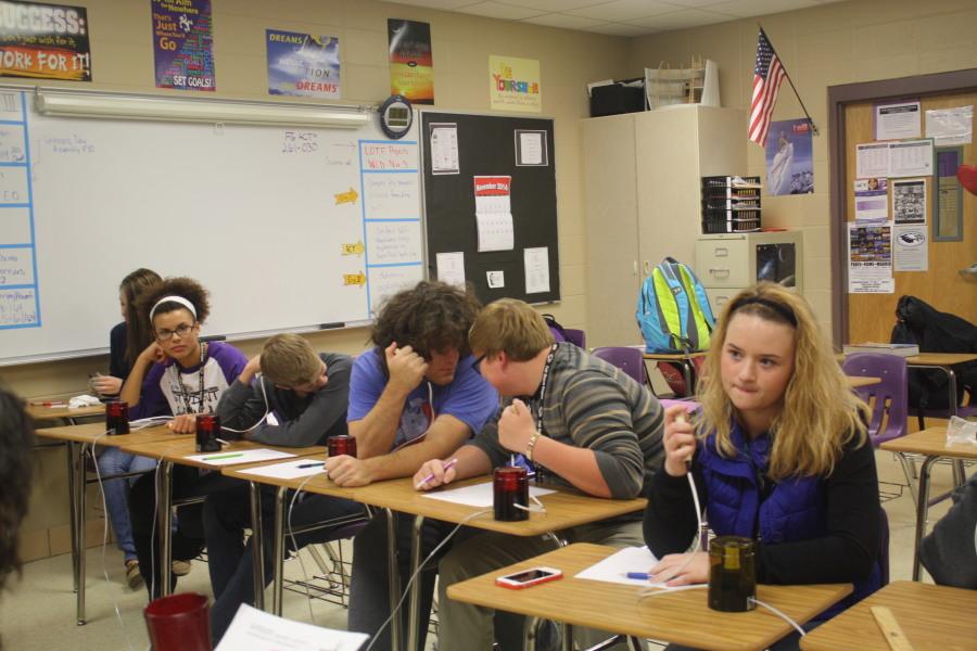 Students practice answering questions at Scholar Bowl Practice.