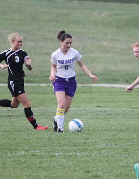 Senior captain, Jordan Robertson, (pictured here as a sophomore) dribbles by defenders.