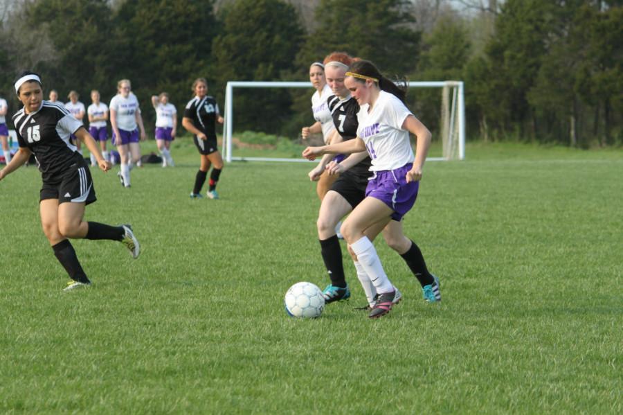 Jorden Stacey looks to get  past a defender in a Lady Eagles home game. 