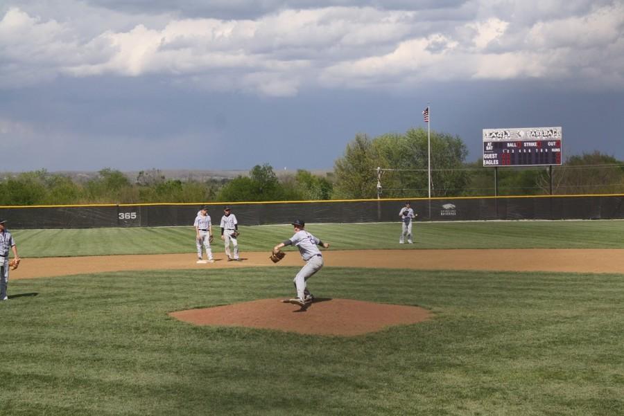 Junior Coby Church warms up pitching to start off start off the game. 