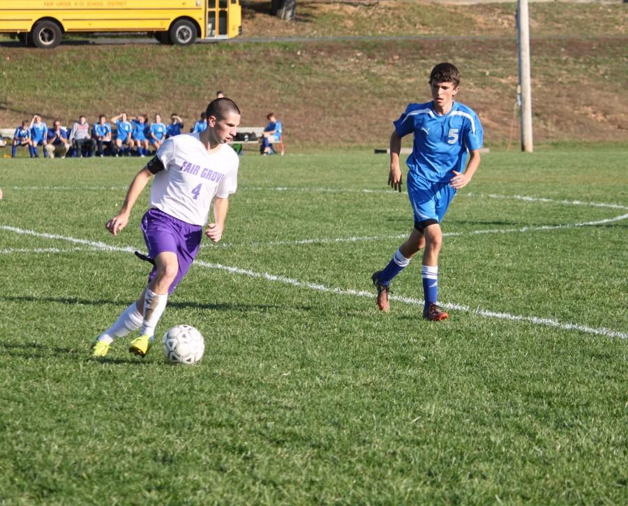 Preston Padgett (12), pictured here playing against Cole Camp in the Stover Classic Tournament, will be playing for Evangel University next Fall. 