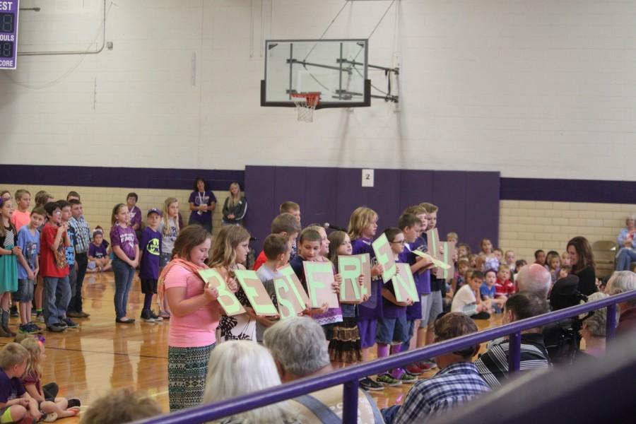 Elementary students perform for their grandparents.