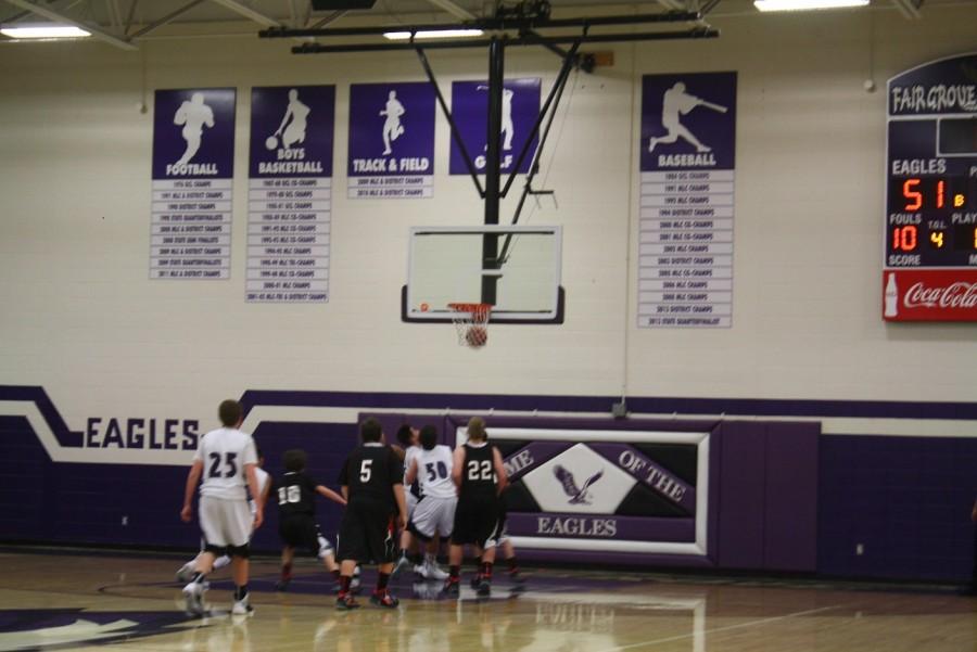 Rhett Hill (9), and Kyle  Stacey (9) defend in a home game against Buffalo. 