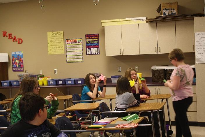 Middle school students learn different origai techniques.
