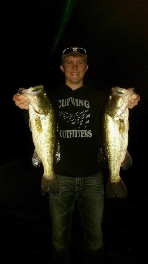 Fishing team member, Patrick Potter, holds up his double catch of the night at Lake of the Ozarks.
