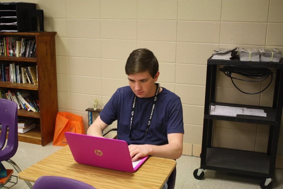 Dylan Bates (11), connects his laptop with the schools wifi.