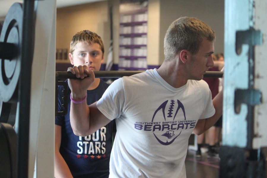 Matthew Emert (11) prepares to do squats in the weight room.
PHOTO BY ELIAS MORELAN