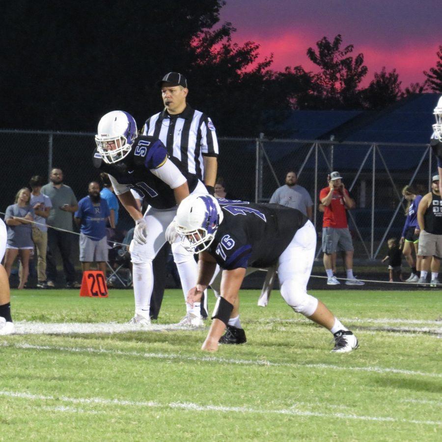 Stewart Hopkins (11) and Daniel Terry (12) set up for the next play. PHOTO BY KELSEY BRUNKHORST