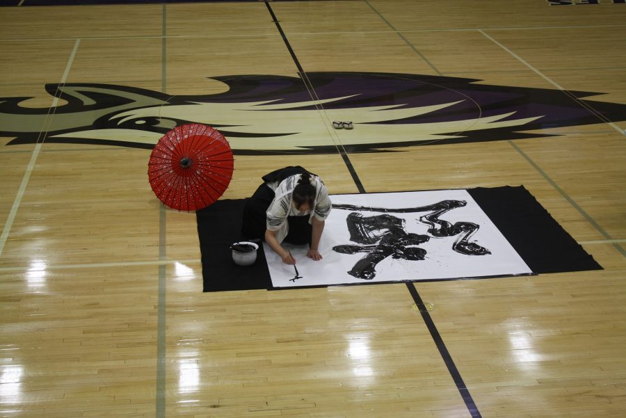 Seiran Chiba paints large-scale calligraphy during an assembly.
PHOTO BY LEAH WAHLQUIST 