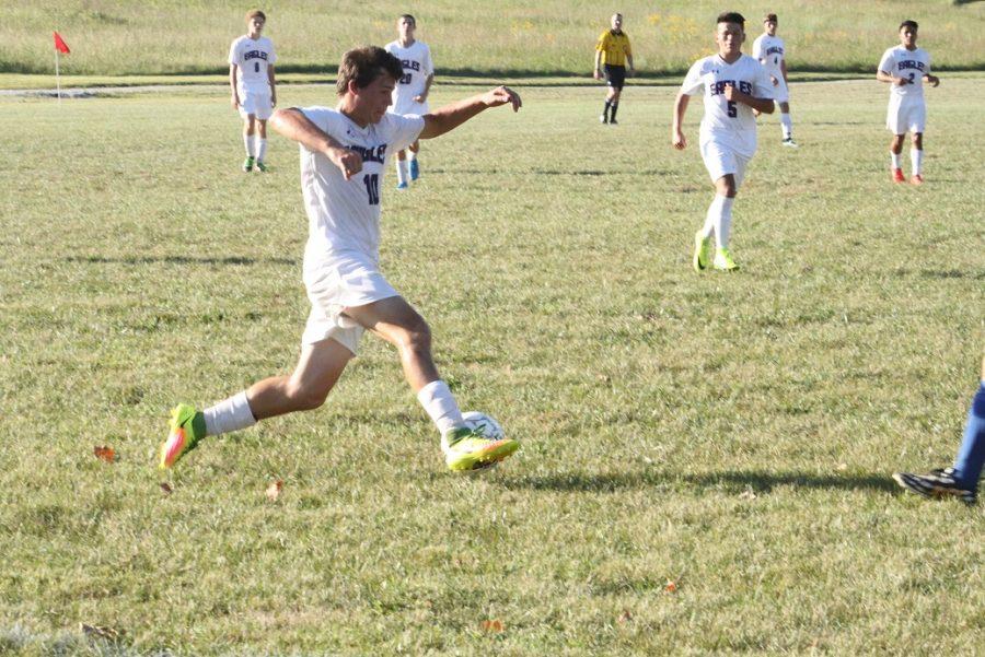 Damon Miles (11) dribbles the ball down the field.
PHOTO BY STEWART HOPKINS