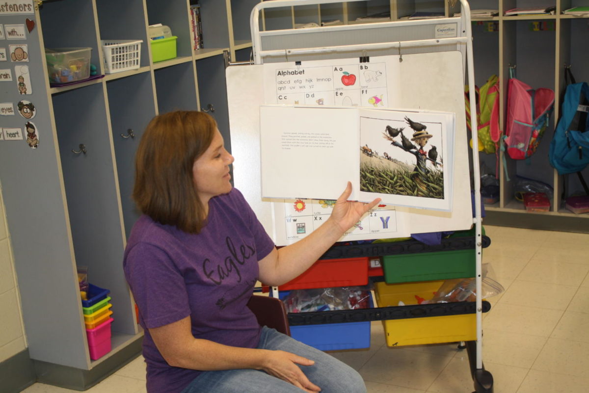 Mrs. Arnold reads to her kindergarten class.