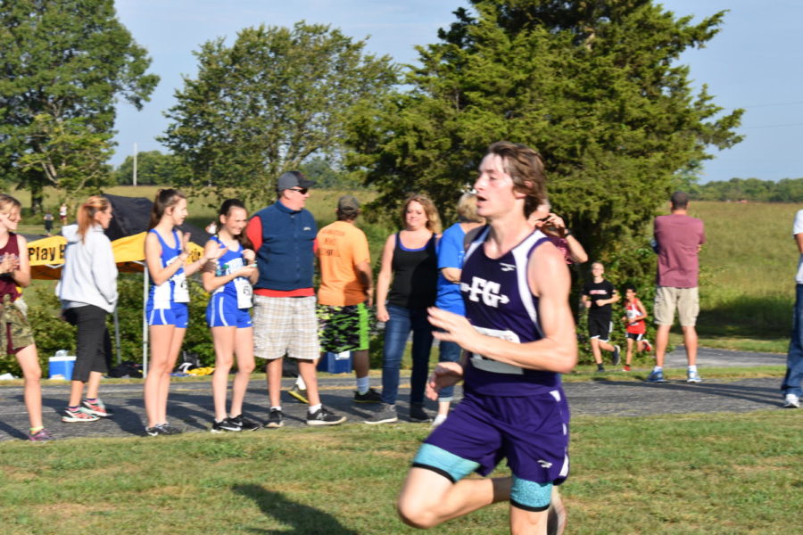 Ryan Odom (11) races to the finish.