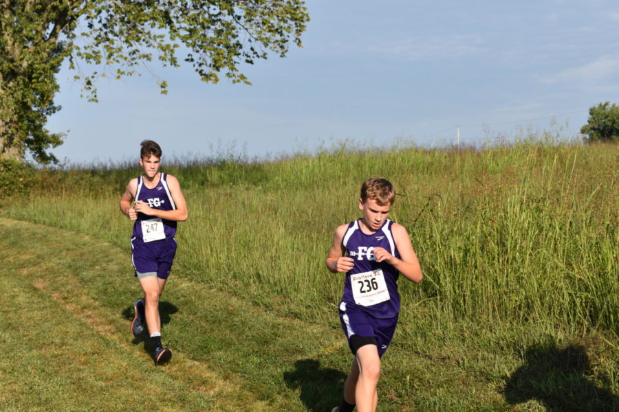 Alex Ince (left) and Hayden Pierce (right) compete during a meet.