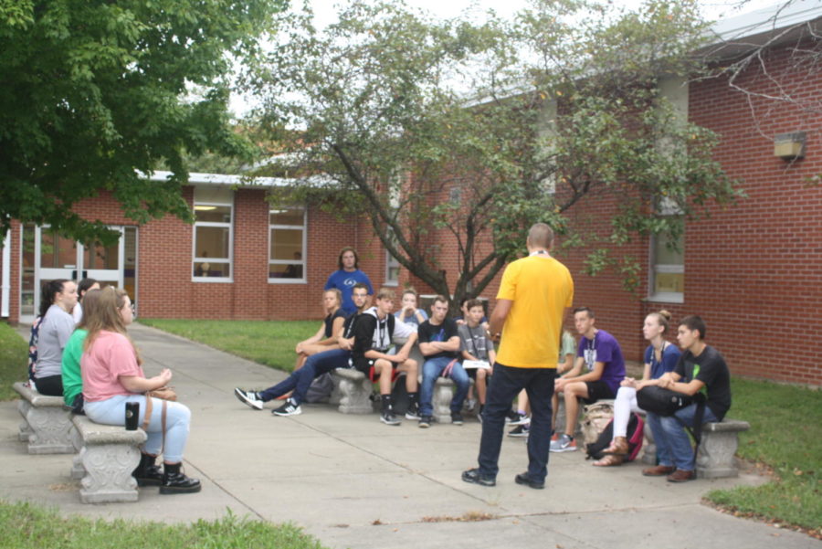 Students meet with Mr. Foster in the courtyard for JOLT