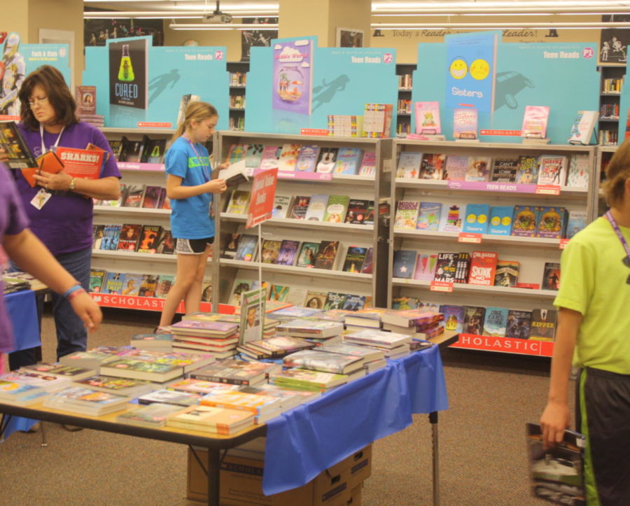 Middle school students enjoy the book fair (2014)