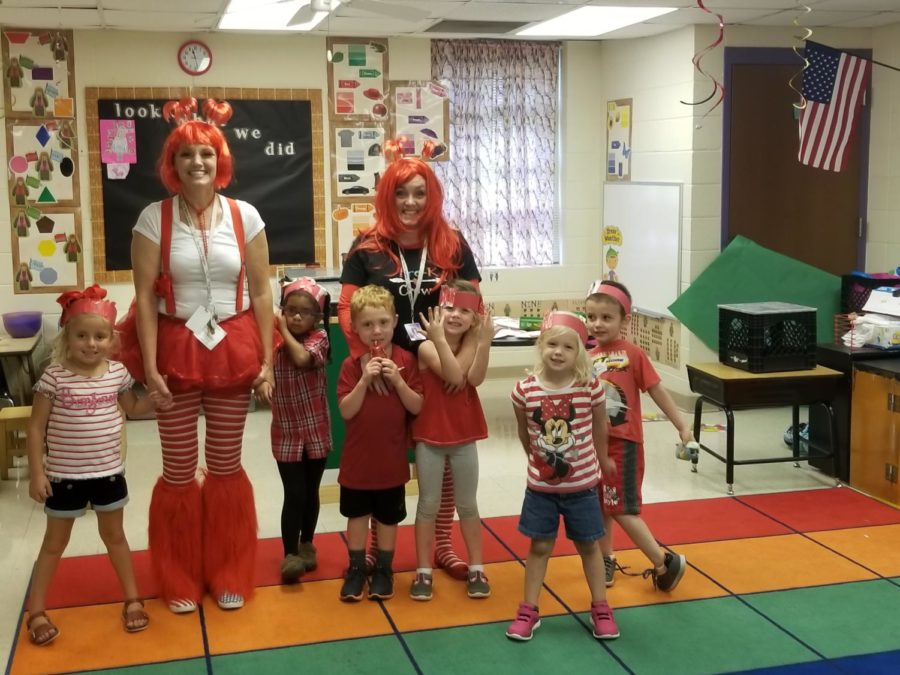 Mrs. Hill poses with some of her students on Red Day

Photo from the Fair Grove School website