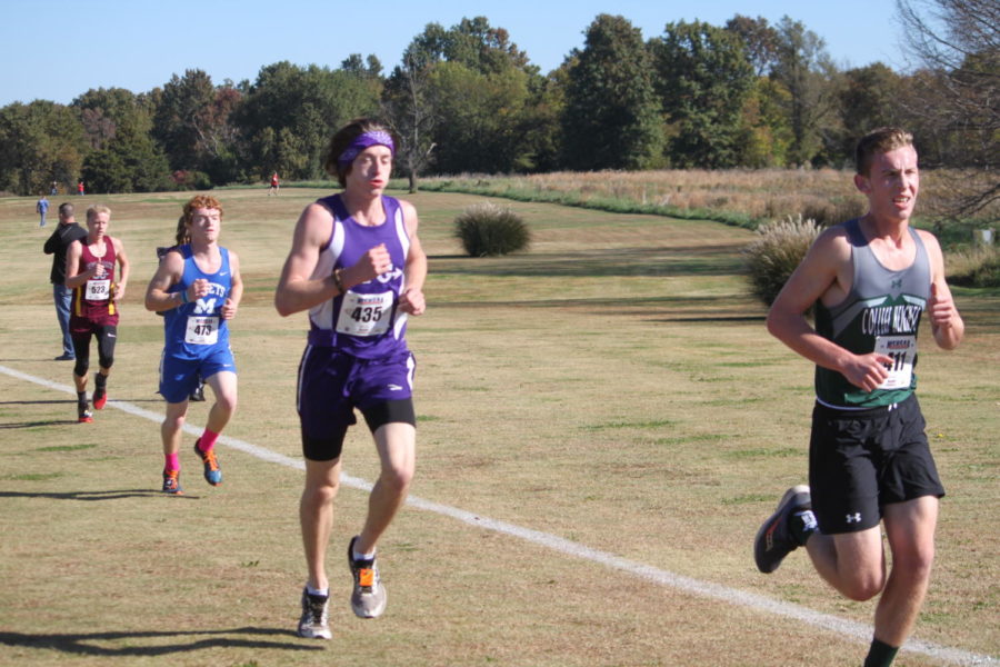 Ryan Odom (12) competes at cross country districts.