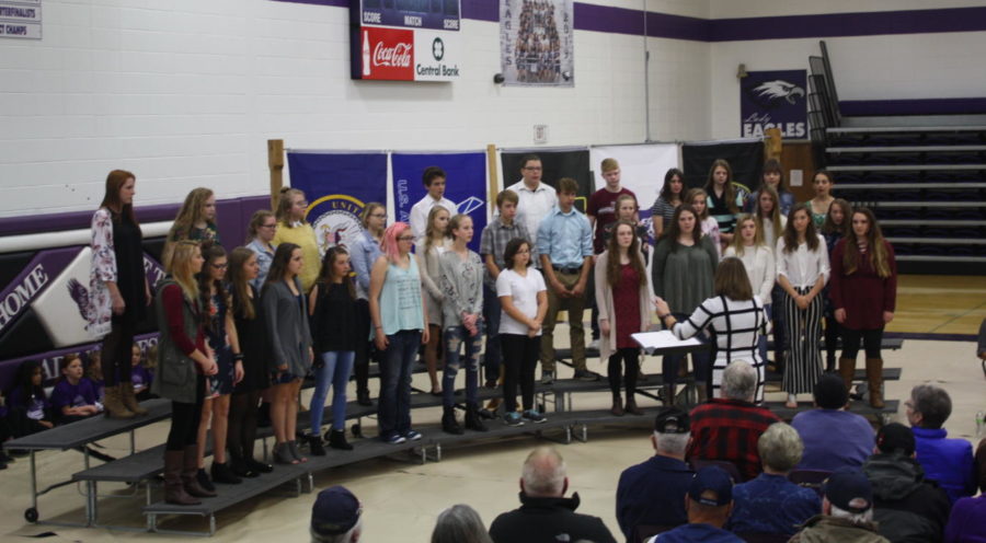 The high school choir performs at the Veterans Day Assembly