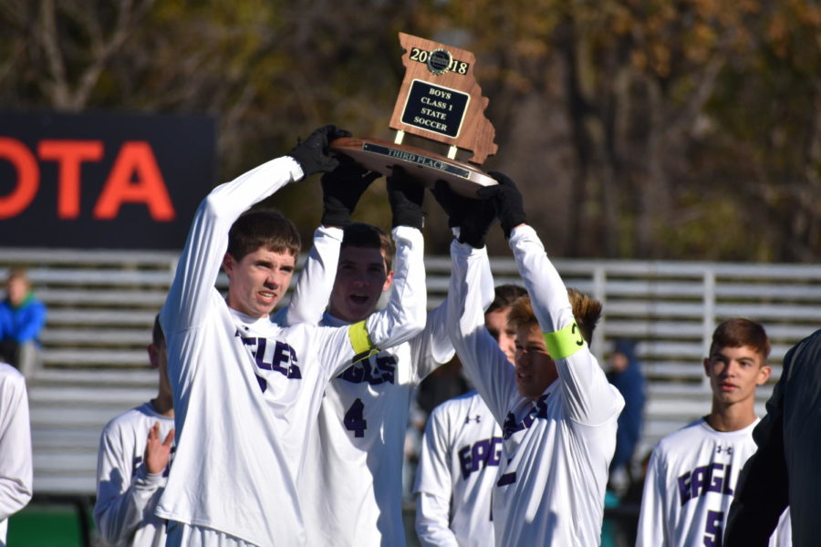 Kamron Stacey, Kyle Stacey, and Maicol Newkirk celebrate during State.