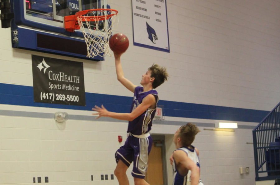 Tyler Padgett (9) goes up for a layup