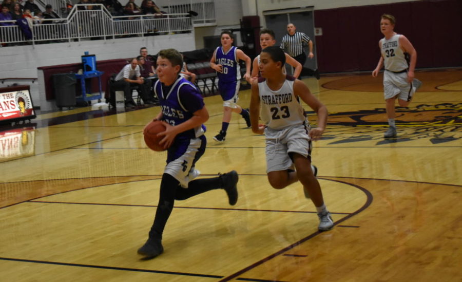 Fair Grove basketball player goes up for a layup.