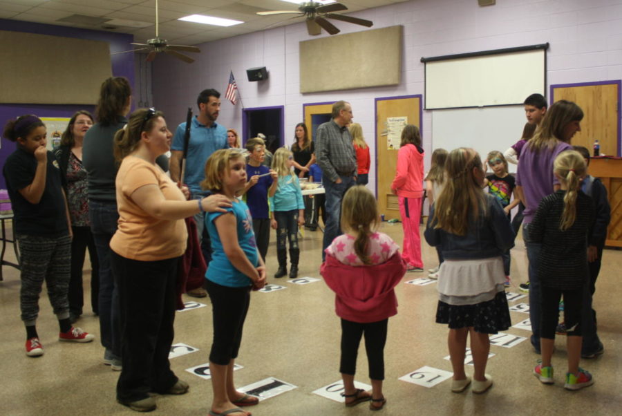 Elementary children participate in a game at the carnival. Photo from 2015.