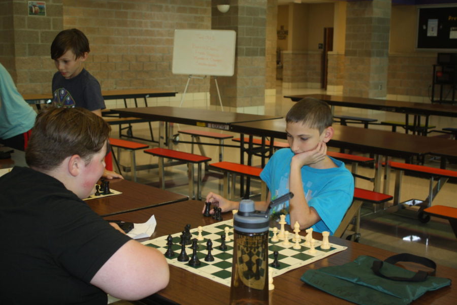 Students enjoy Chess Club; however,  it will be cancelled because of low test scores. 