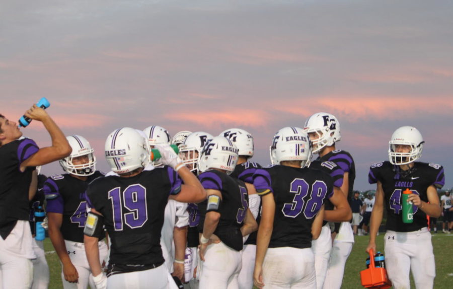 Fair Grove Football team standing at the sidelines during a timeout.