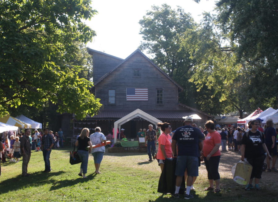 Fair Groves infamous Wommack Mill, surrounded by Fall Festival goers and booths