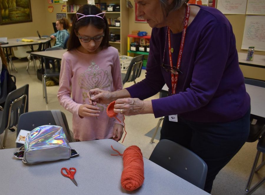 Ms. Meals helping students during crotchet club