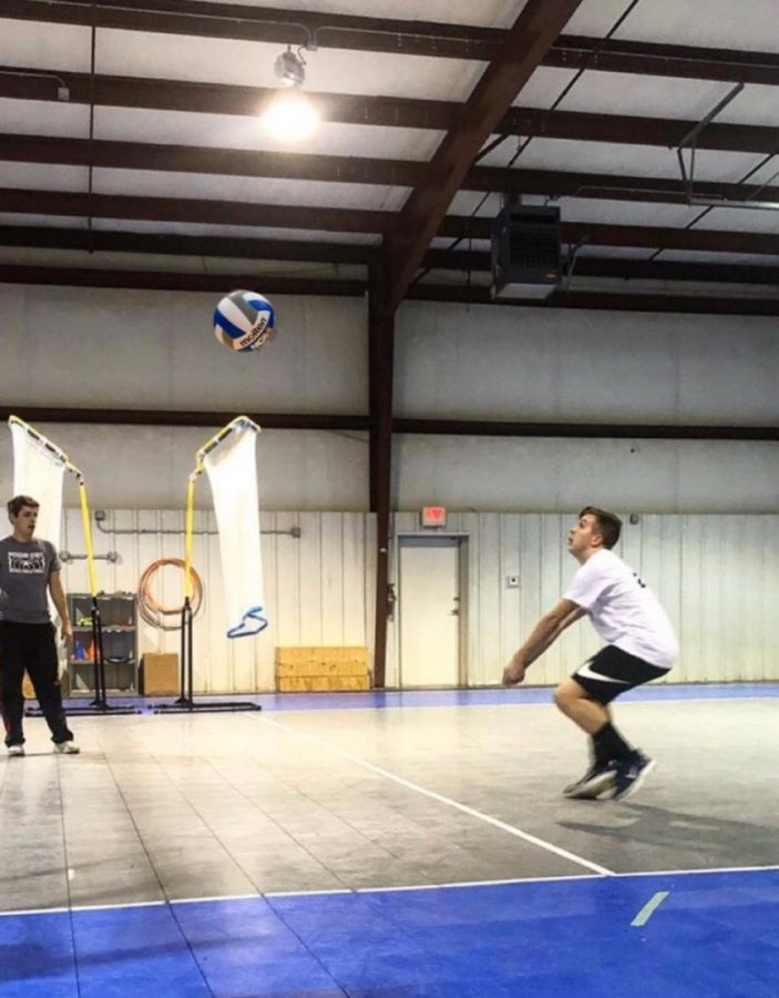 Cooper Zumwalt practicing for his out of school volleyball