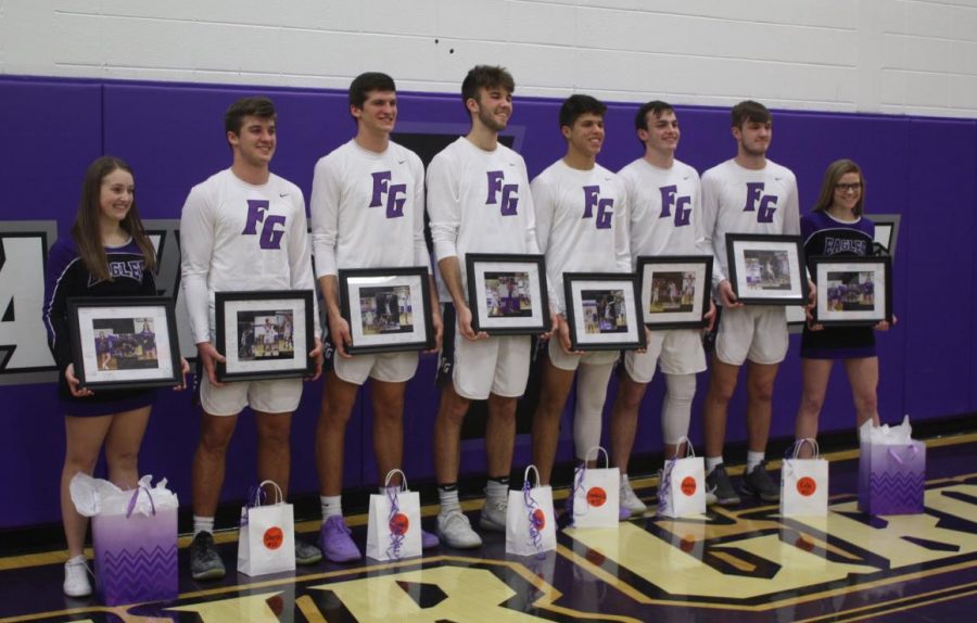 Senior cheerleaders Heather McDougal, Brooke Heavin with senior basketball boys Darin Oplotnik, David Oplotnik, Alex Ince, Dominick Hoskins, Ambrose Broyles and Cole Gilpin