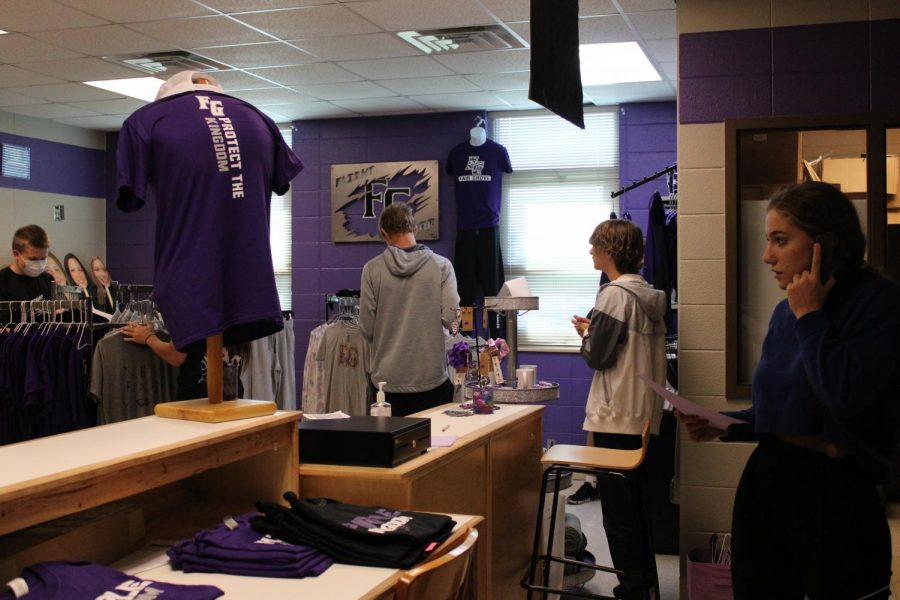 Fair Grove High School students helping to set up the school store: Flight Gear.
