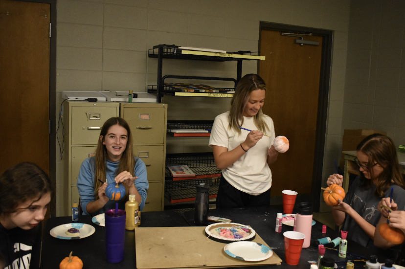 Fair Grove High School Art Club painting pumpkins during the first meeting of the year.