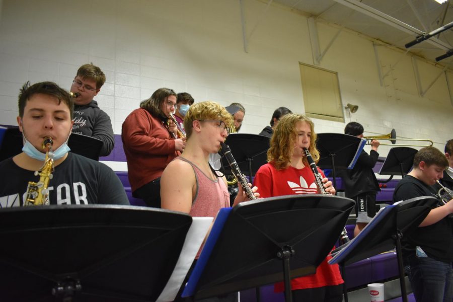 Current seniors Calvin Zuch (left), Nicky Hamp (middle), and current sophomore Seth Hardison (right) playing last season in pep band. 