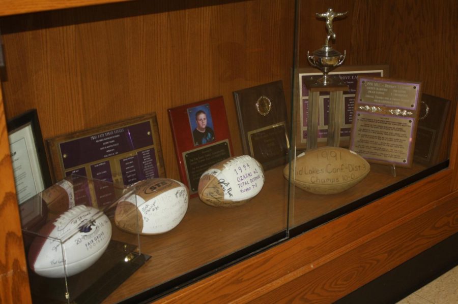 Memorial trophy case for Fair Grove Footballs greatest seasons, located in the Fair Grove High School Gym Lobby.