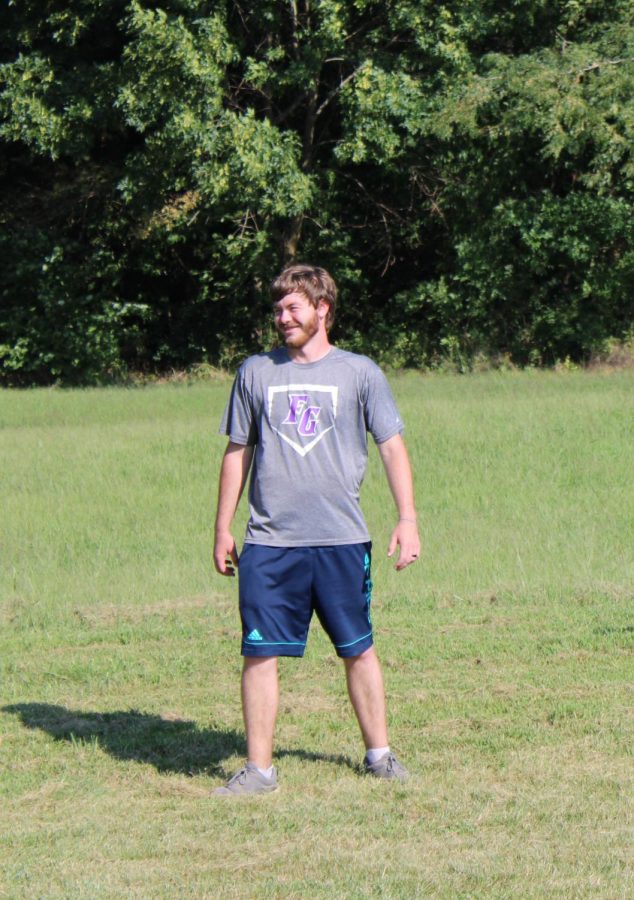 Mr. Supancic cheering on cross country runners at a home meet. 