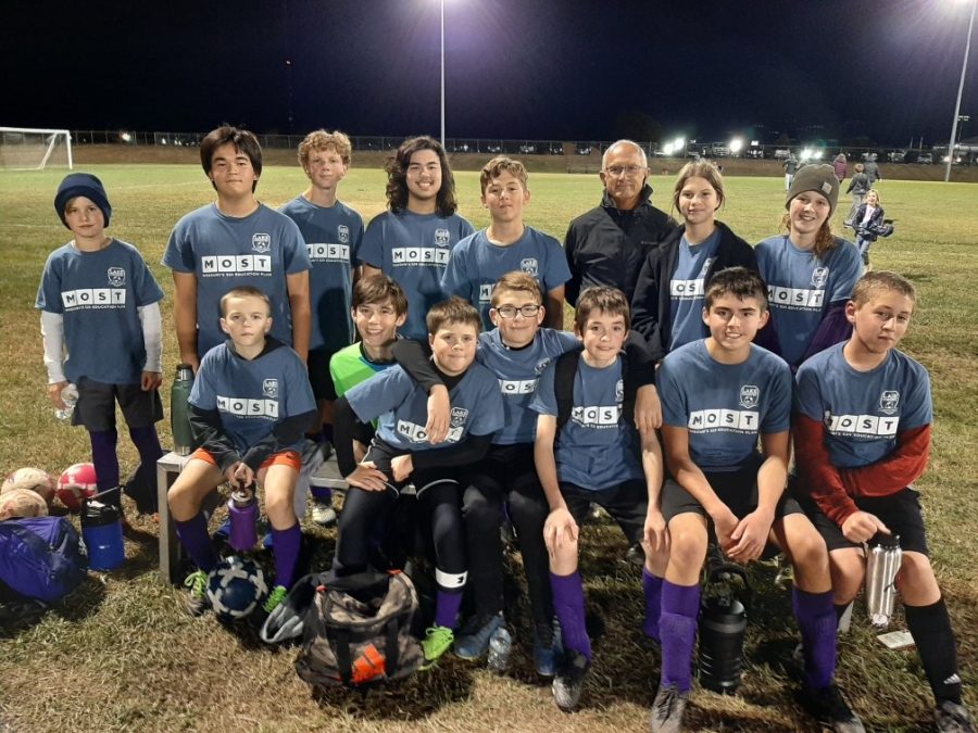 Image of the Fair Grove Middle School Soccer Team. Pictured in the top row from left to right is Cayden Brewer, Jesse Elliston, Jon Peak, Connor Ridinger, Bob Florez, Grace Batts, and Cheyenne Miller. Pictured in the second row is Ty Hart, Wes Hart, Brady Towry, Judson Morrison, Devon Greek, Eli Sanders, and Tyler Whitehead.