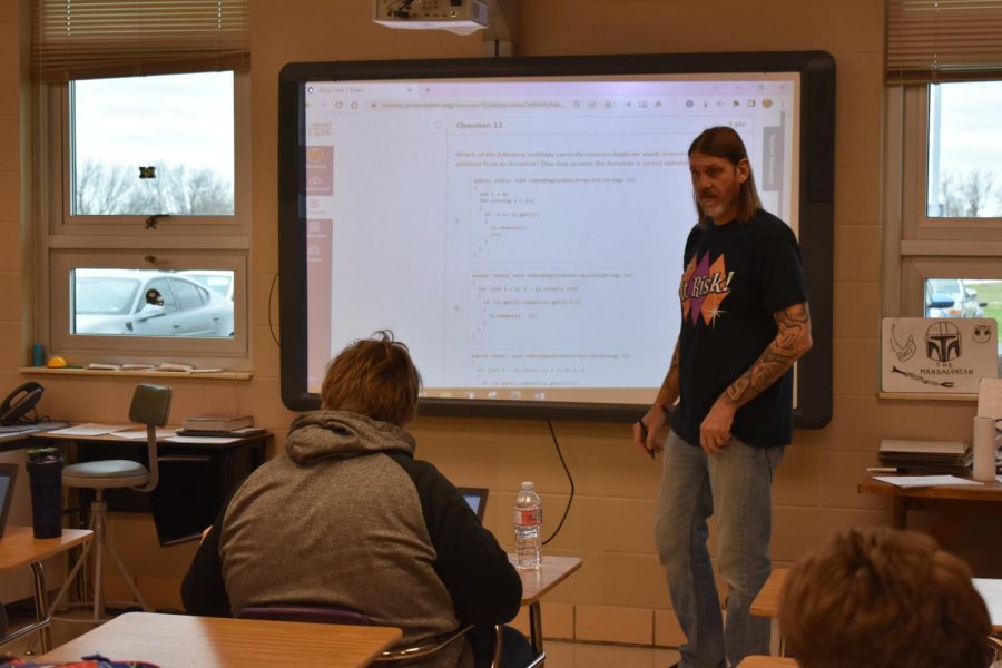 Mike Van Cleave assisting his students through a problem (Photo Credit Easton Beltz).