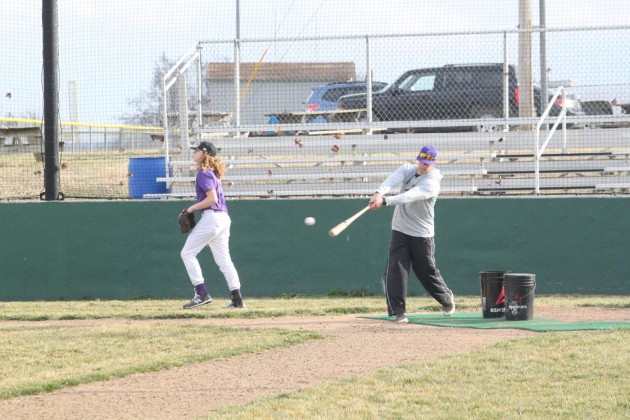 Christian Overstreet batting to his baseball players at practice on 3/9/2021, photo credit of FG Newspaper staff. 
