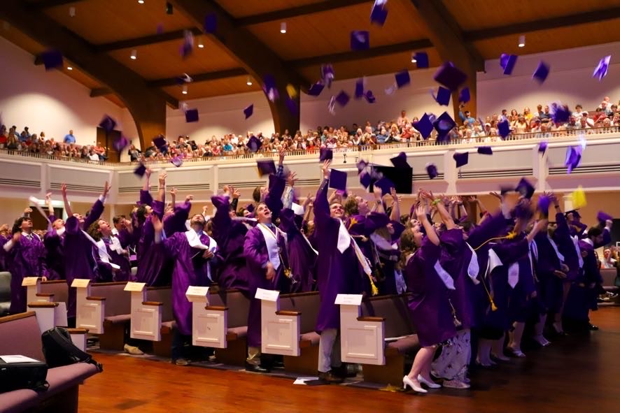 Graduating Class of 2022  throwing their caps in the air. (photo provided by Melissa Greene)
