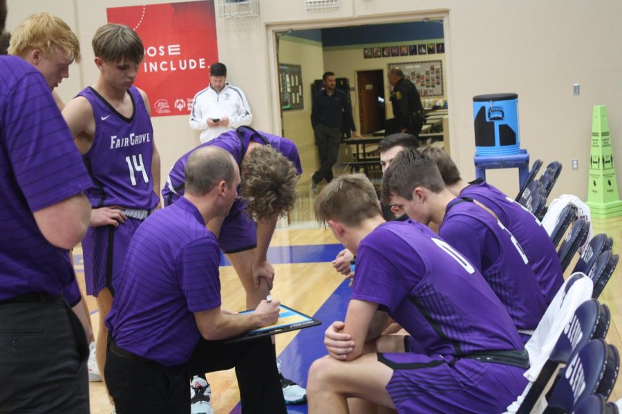 Fair Grove Boys High School Basketball Team in a team discussion at the 11/30 Clever Game. Photo provided by Hadie Wingo