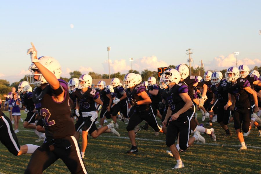 Fair Grove Football Team running onto the field during their season. (Photo taken by FGS Newspaper Staff)