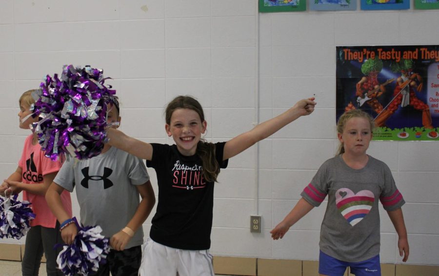 Camdyn Buffington (left) and Stori Letterman (right) practicing their cheer. (Photo taken by Sophia Brumfield)