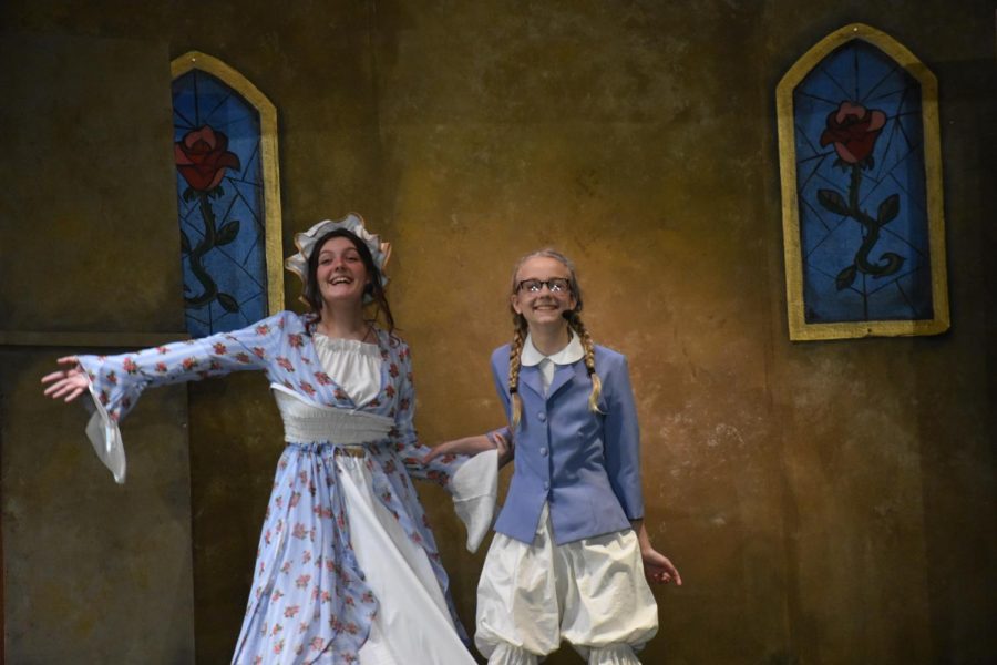 Natalie Nolan and Alyssa Faubion preforming at the 2021-2022 play, Beauty and the Beast. (Photo taken by Bryleigh Mays)