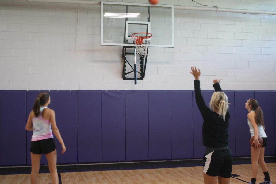Fair Grove Girls Basketball players practicing for the upcoming season. From left to right: Sache Dowling, Grace Chastain, and Rebecca Kepes. (Photo taken by Mattilee Wilson)