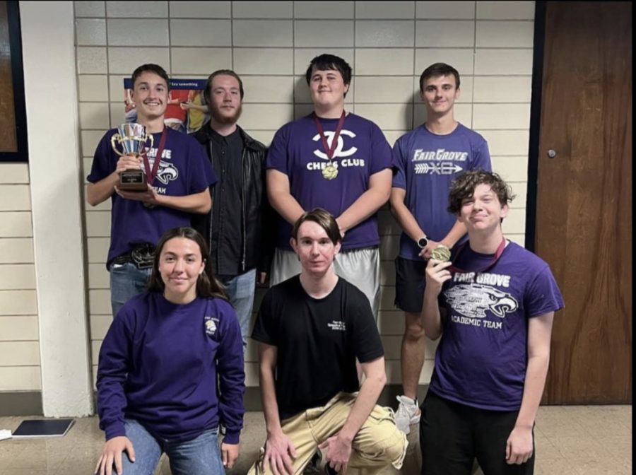 The Scholar Bowl team posing with their trophies at the Glendale competition on 10/15. Top: Braden Booth, Luc Deeds, Christian Allen, and Liam Draper. Bottom: Karla Sabata, Nate Wagnor, and Charlie Harp. (Photo taken by Coach Michelle Wahlquist)