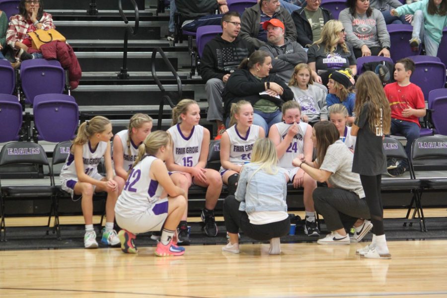 The Fair Grove Middle School 7th grade Lady Eagles during a timeout against Strafford Middle School on 11/28. (photo taken by Brooklyn Williams)
